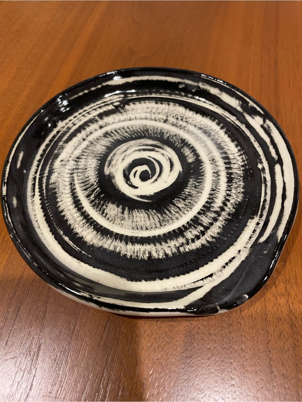 Handcrafted Black and Cream Ceramic spoon rest with Spiral Motif